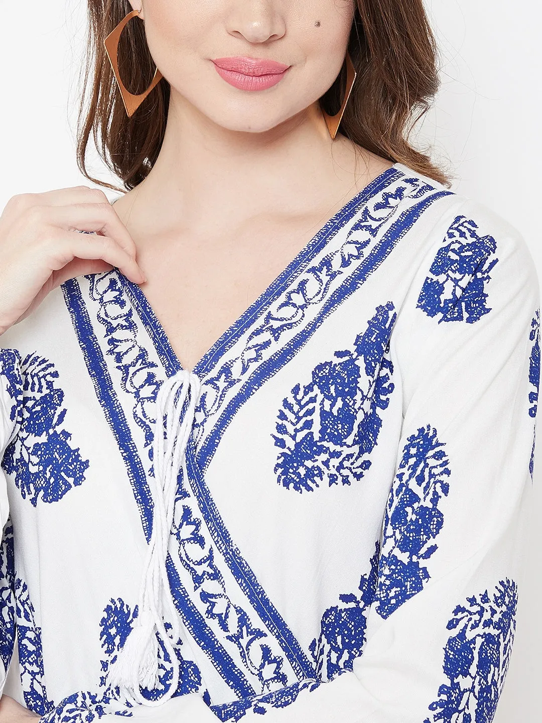 Berrylush Women White & Blue Floral Printed V-Neck Medium Transparent Blouson Top